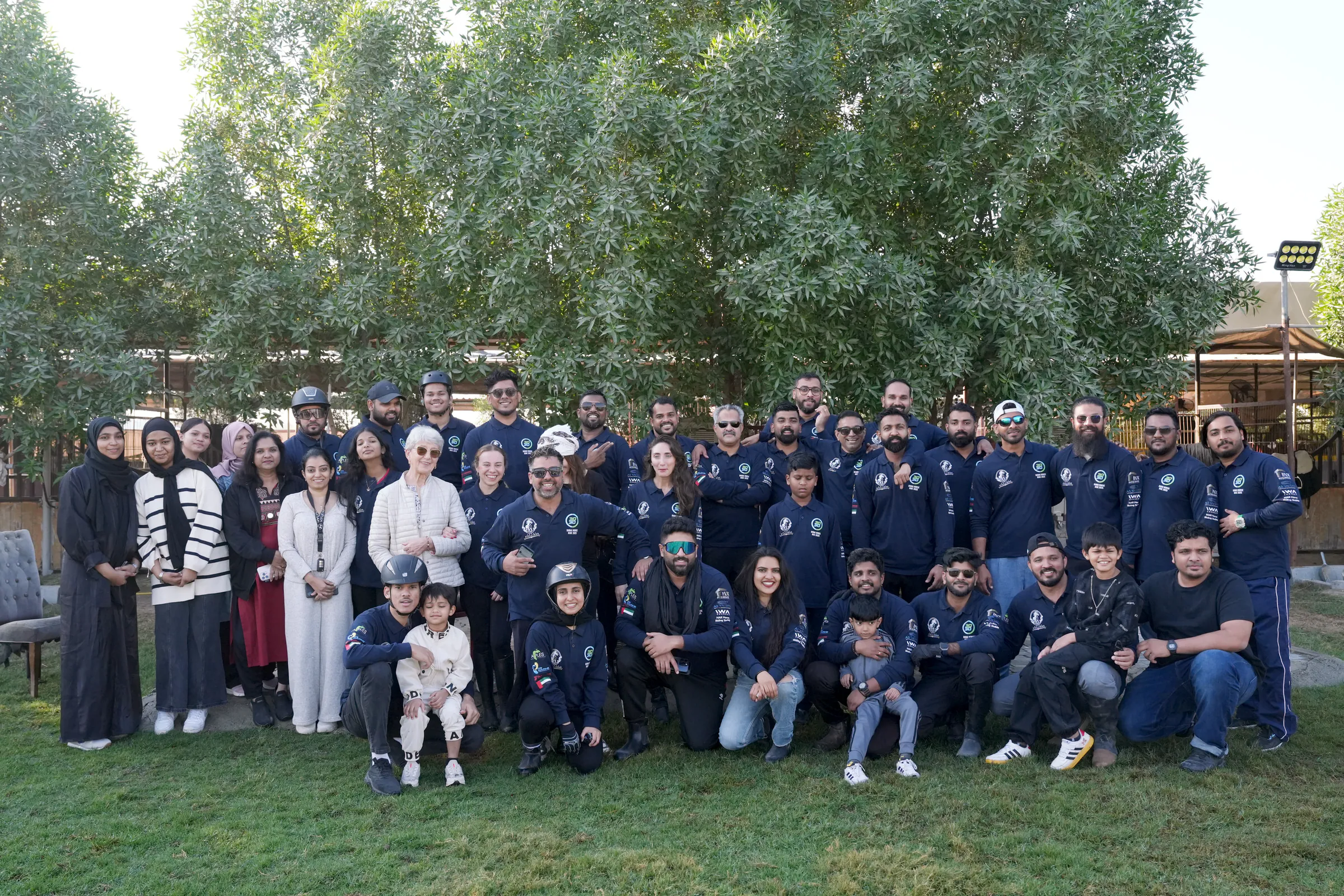 Club members and their families gathered on the lawn after the National Day ride